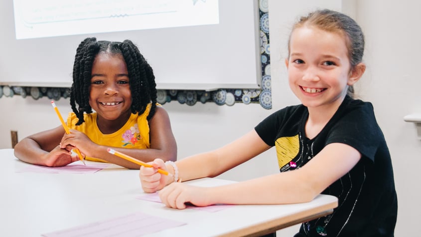 2 girls writing