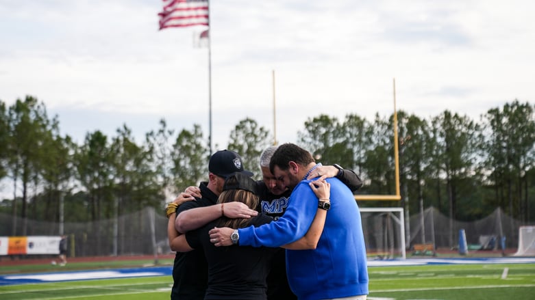 Coaches Praying 16x9