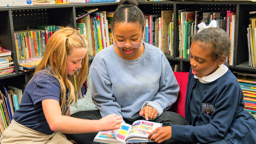 Emily reading with kids